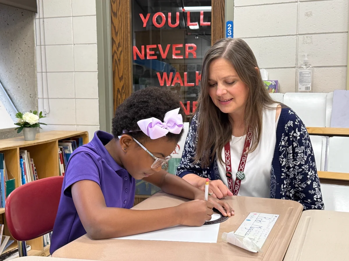 BCSC teacher working one-on-one with a student